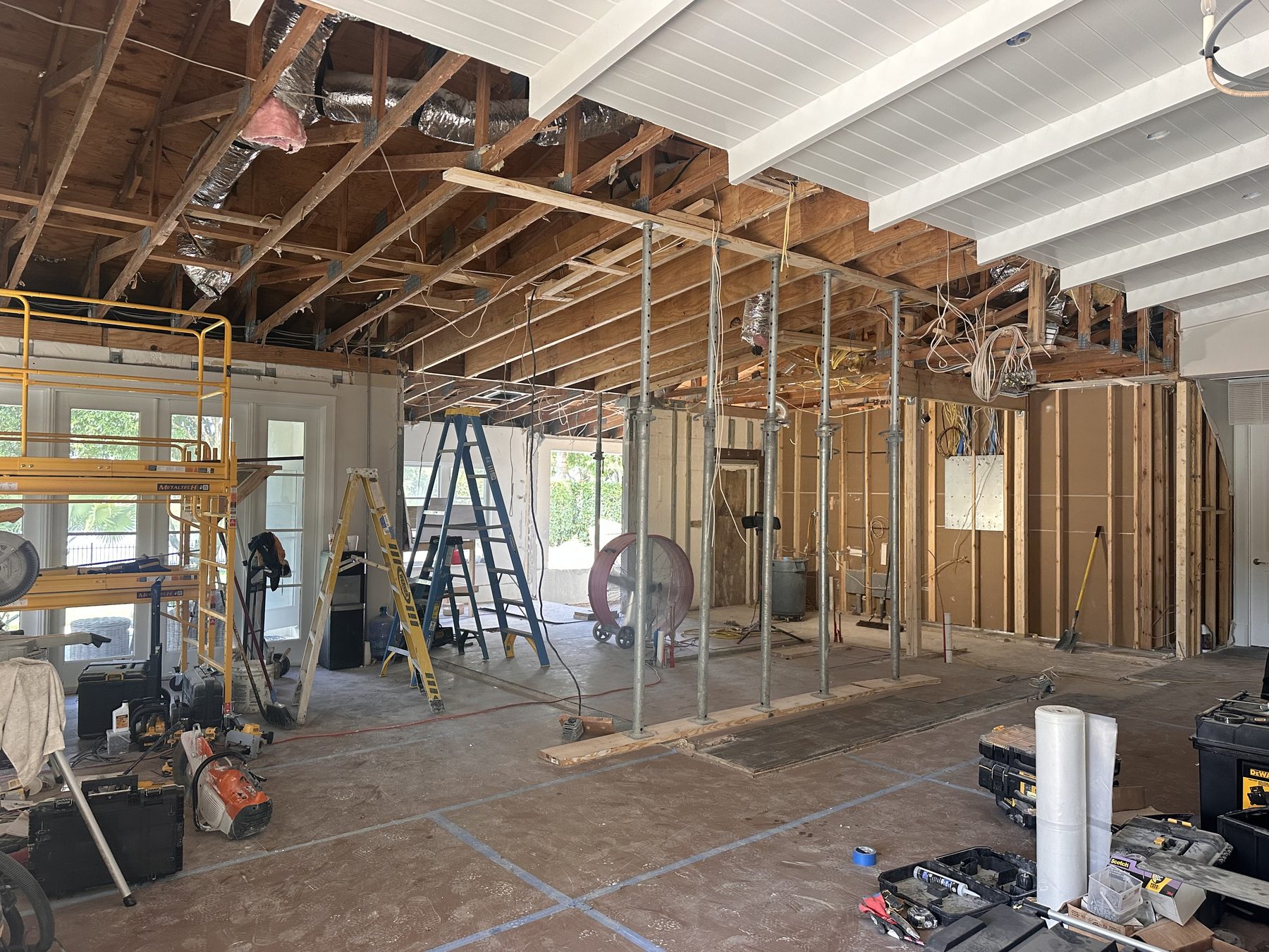 Great room during structural work with temporary shoring